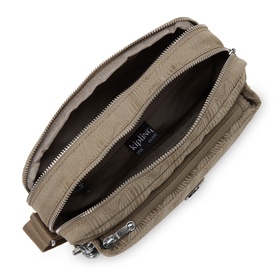 Kipling crossbody bag in taupe textured nylon, open to show spacious interior, silver-tone zip hardware visible