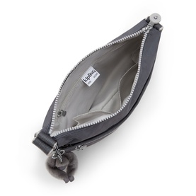 Kipling grey crossbody bag interior view, showing zip opening, light grey lining, and signature monkey keychain charm.