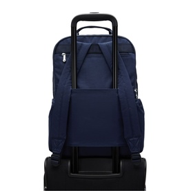 Navy blue backpack shown from rear, with trolley sleeve over luggage handle, zip pocket and padded back panel visible