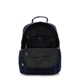 Kipling navy blue backpack shown open, revealing black interior lining, zip pockets, and padded back panel with carry handle.