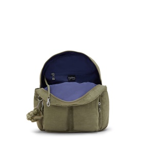 Kipling green backpack open to reveal purple-lined interior, multiple compartments, and silver hardware visible.