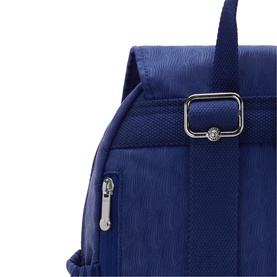 Close-up of navy blue nylon backpack showing silver-tone buckle strap fastening and zip side pocket detail.