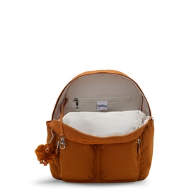 Kipling orange nylon backpack, open top view showing spacious cream interior lining and front zip pockets with signature monkey keyring.