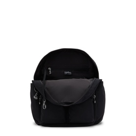Kipling black backpack shown open, revealing grey interior lining with multiple zip pockets and silver-tone hardware.