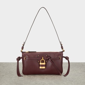 Chlo&eacute; Burnt Red lambskin shoulder bag with gold padlock detail, knot side ties, and adjustable single shoulder strap
