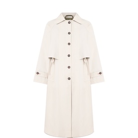 Damson Madder Camille Single-Breasted Trenchcoat in cream with storm flap, button fastenings, and double button cuffs