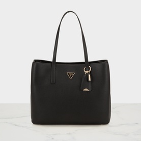 Guess black tote bag with gold-tone triangle logo, tassel keyring charm, and double top handles, on marble surface