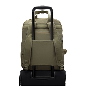 Sage green backpack with luggage pass-through sleeve, padded shoulder straps, mounted on a black wheeled suitcase