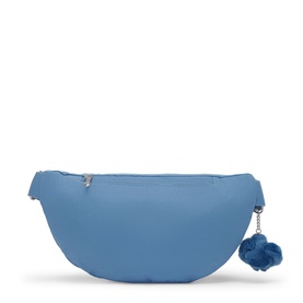 Kipling Vintage Blue belt bag with silver-tone zip, adjustable strap, and signature blue pom-pom charm detail.