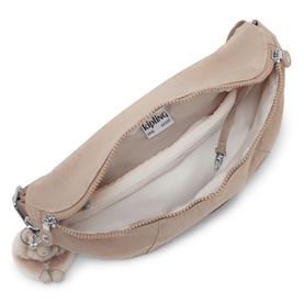 Kipling bag in nude pink, open top-down view showing cream interior lining, zip closure, and signature monkey keychain charm.