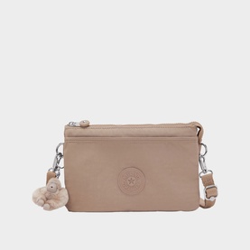 Kipling beige crossbody bag with silver-tone zip, embossed logo, adjustable strap and signature monkey keyring charm