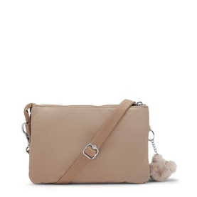 Kipling crossbody bag in taupe with silver-tone hardware, adjustable strap, and signature monkey keychain