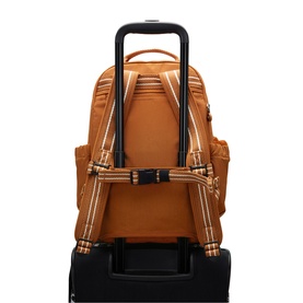Kipling backpack in Stylish Mokka tan, shown attached to luggage trolley handle via back sleeve, with padded straps visible.