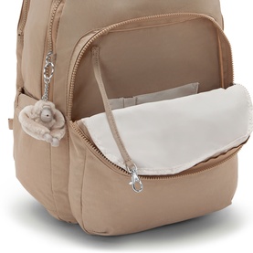Kipling backpack in beige, open main compartment with interior view, silver-tone zips and signature monkey keychain detail