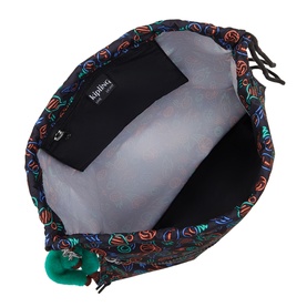 Kipling bag interior showing grey lining, black zip pocket, multicolour printed trim and green monkey keychain charm.