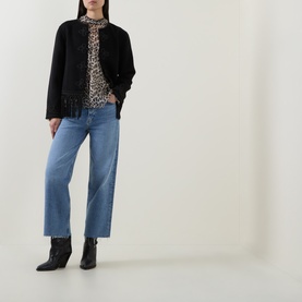 Model wearing AgoldE Wide Leg jeans in Measure, styled with black jacket, leopard print top and black ankle boots.