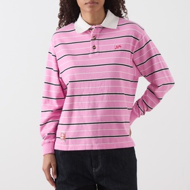 Model wearing Damson Madder pink stripe cotton rugby polo top with white collar and navy stripes, styled with dark jeans.