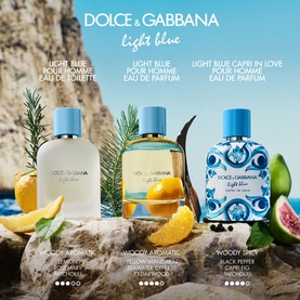 Dolce & Gabbana Light Blue fragrance trio: Pour Homme EDT, Pour Homme EDP, and Capri In Love Pour Homme EDP, displayed with citrus and herbs