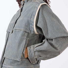 Model wearing Isabel Marant Etoile multi-coloured striped cotton jacket with chest pockets and contrast cream trim detail.