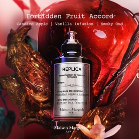 Maison Margiela Replica Lost Eden Eau de Parfum bottle surrounded by rich red apple and smoky oud-inspired editorial backdrop.