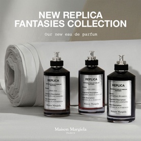 Maison Margiela Replica Fantasies Collection, three dark eau de parfum bottles with white labels on grey background.