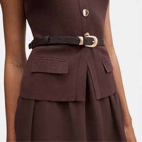 Model wearing Forever New chocolate dress with patch pockets and gold-buckle belt, close-up detail view.