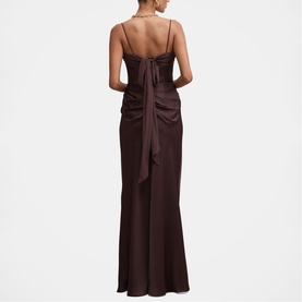 Model wearing Forever New chocolate maxi dress, spaghetti straps, draped back detail with bow, shown from behind