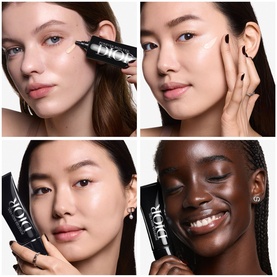 Four models showcasing Dior Makeup Primer, each holding the black tube, displaying radiant, primed skin across diverse complexions.