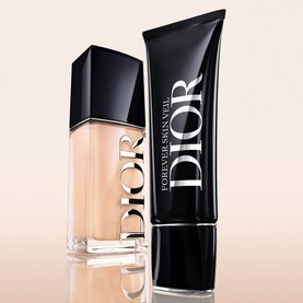 Dior Forever Skin Veil makeup primer shown in bottle and tube formats against a soft peach background