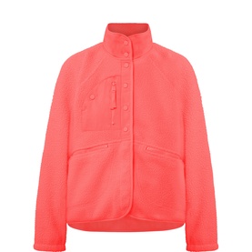 Free People Movement jacket in Just Peachy, coral fleece with funnel neck, zip chest pocket and snap-button front fastening.