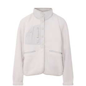 Free People Movement muted beige fleece jacket with chest pocket, zip pockets, and snap-button placket, laid flat