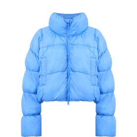Free People Movement Rivera Blue cropped puffer jacket with high neck, zip front, and voluminous quilted sleeves