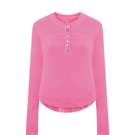 Free People Movement Hot Pink long-sleeve henley sweat top with button placket and curved hem, 95% cotton
