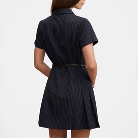 Model wearing Forever New navy pinstripe mini shirt dress with pleated skirt, short sleeves, and slim black belt, back view.