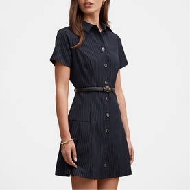 Model wearing Forever New navy pinstripe short-sleeve shirt dress with button front, patch pockets, and slim belt.