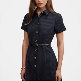 Model wearing Forever New navy pinstripe short-sleeve shirt dress with button front, patch pockets, and slim tan belt.