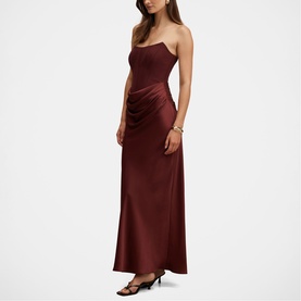 Model wearing Forever New Vintage Burgundy satin strapless maxi dress with ruched side detail and bias-cut skirt.