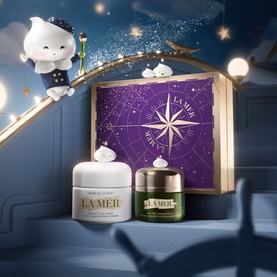 La Mer Eye Renewal & Hydration Gift Set with two cream jars and star-map gift box, styled with whimsical cloud characters in a celestial scene