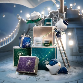 La Mer Genaissance De La Mer Anti-Ageing Skincare Gift Set displayed in a festive winter scene with glittering gift boxes and snowman decorations