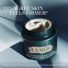 La Mer Rejuvenating Anti-Ageing Skincare Gift Set; open jar of The Rejuvenating Night Cream in dark teal packaging on draped fabric
