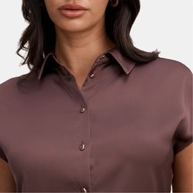 Model wearing Forever New Chocolate Brownie satin-finish shirt dress with cap sleeves and button-front detail, close-up view