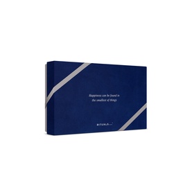 Rituals Homme Small Gift Set in navy blue rectangular box with silver ribbon detail and cursive text on front.
