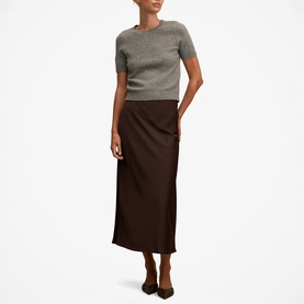 Model wearing Forever New chocolate midi slip skirt styled with grey short-sleeve knit top and brown heels.