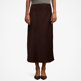 Model wearing Forever New chocolate satin midi skirt, styled with a grey knit top and black pointed-toe flats.