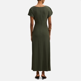 Model wearing Forever New Thyme Green maxi dress with short sleeves, V-back neckline, and fitted silhouette, shown from behind.