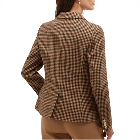 Model wearing Hobbs brown multi houndstooth check blazer, shown from the back, with tan trousers