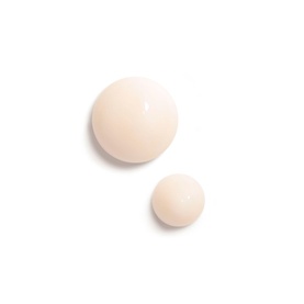 Chanel Fluide firming treatment texture swatch showing two drops of pale pink fluid on white background