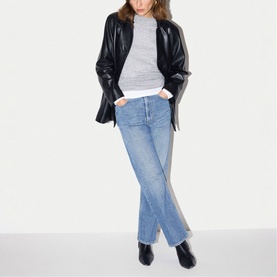 Model wearing Jigsaw Grey Melange top, styled with black leather jacket, blue wide-leg jeans and black ankle boots.