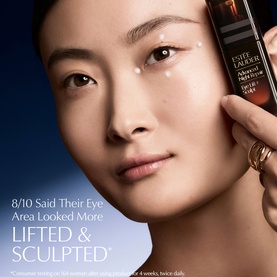 Model with Est&eacute;e Lauder Advanced Night Repair Discovery Skincare Set, applicator shown near eye area demonstrating lifting and sculpting benefits.