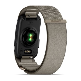 Garmin smart fitness tracker rear view, dark hardware with green sensor, paired with a tan woven loop strap